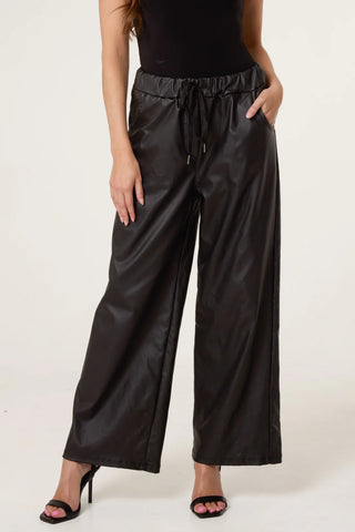 Lillan Plain Black Pleather Wide Leg Trousers With A Drawstring Waist